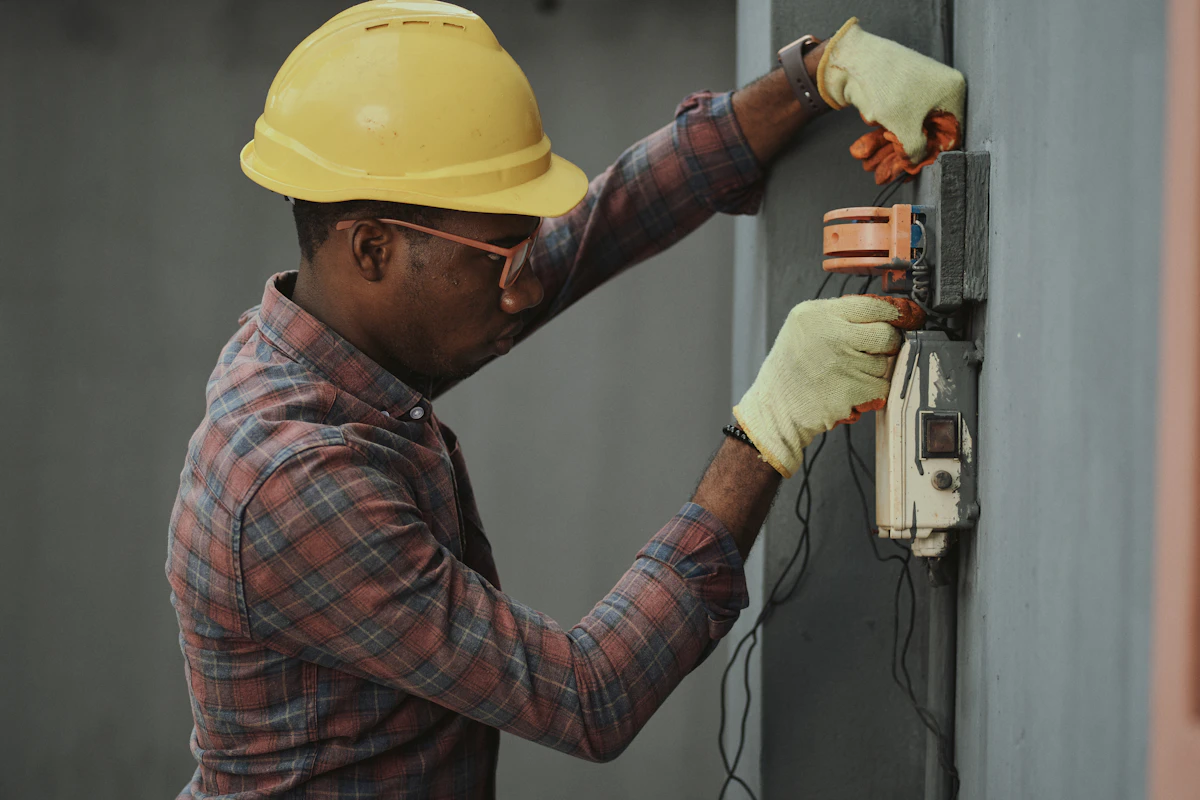 Licensed Iowa Master Electrician wiring a residential standby generator transfer switch panel